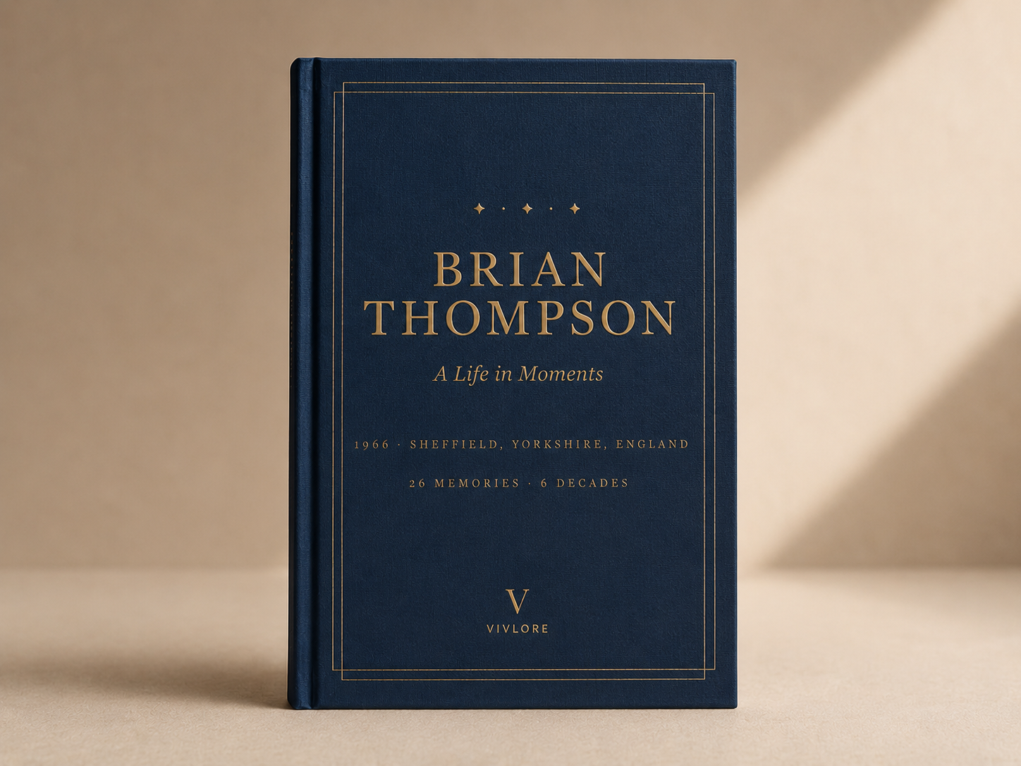 Brian Thompson's Vivlore biography as a navy and gold hardback book, title 'Brian Thompson', subtitle 'A Life in Moments', and the line '1966 · Sheffield, Yorkshire, England · 26 memories · 6 decades'